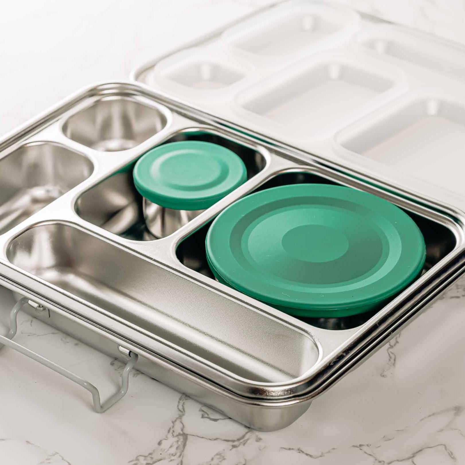 https://agoodstore.co.nz/cdn/shop/products/stainless_steel_bento_lunchbox_five_compartments-14.jpg?crop=center&height=1622&v=1703972279&width=1622